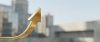 Golden arrow pointing upward against blurred city skyline background symbolizing business growth, success, and financial progress in urban environment.