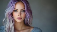 Young woman with vibrant purple pastel hair and piercing blue eyes against blurred background, wearing casual gray top, showcasing modern beauty trends.