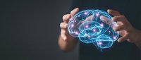 Hands protecting glowing digital brain with neural networks and connections representing artificial intelligence, mental health care and cognitive protection.