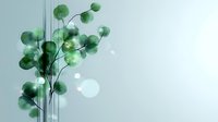 Delicate green eucalyptus leaves with soft bokeh effect on light background. Minimalist botanical art composition with gentle nature elements and ethereal atmosphere.