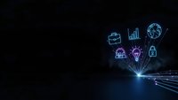 Digital technology concept with glowing neon business icons emerging from bright light source on dark background for presentations and marketing materials.