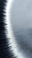 Brushed metal surface with directional light creating dynamic streaks and highlights, suitable for backgrounds, textures, and industrial design projects.