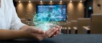 Businessman holding glowing digital brain with neural network connections and data visualization in modern office environment for technology presentations.