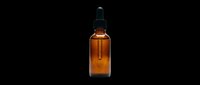Amber glass dropper bottle with black pipette cap isolated on transparent background, ready for cosmetics, essential oils, serums, and wellness product packaging designs for print-on-demand and sublimation.