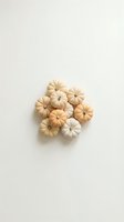 Small decorative pumpkins in neutral cream and beige tones arranged on white background for autumn seasonal design and fall harvest decoration projects.