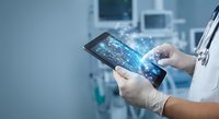 Medical professional using digital tablet with holographic interface in modern hospital room for patient data analysis and healthcare technology.