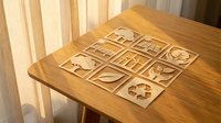 Wooden tic-tac-toe game board with carved symbols on natural wood table surface for family entertainment and leisure activities.