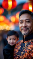 Mature Asian man in traditional mandarin collar jacket with son smiling at Chinese lantern festival celebration. Warm bokeh lights create festive atmosphere.