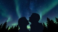 Silhouetted couple kissing under dancing northern lights and starry night sky with evergreen forest below, romantic astronomy scene.