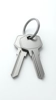 Two shiny silver metal keys on a ring, isolated on white background. Security and access concept for real estate and home ownership.