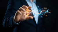 Businessman hand holding glowing digital network connections with data analytics icons floating in futuristic technology concept for business innovation.
