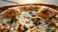 Baked chicken pieces with melted cheese, herbs, and vegetables in a round baking dish, ready for serving as a comforting dinner or family meal.
