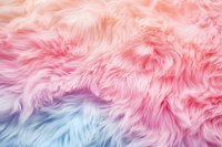 Soft pastel colored faux fur texture in pink, blue and purple shades creates dreamy background for fashion, beauty and lifestyle designs.