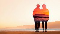 Romantic double exposure silhouette of senior couple merged with sunset ocean view, showing love and companionship against dramatic coastal landscape at dusk.