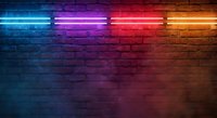Colorful neon lights illuminating brick wall with vibrant blue, purple, red and orange glow creating modern urban atmosphere for nightlife and entertainment venues.