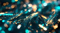 Glowing turquoise and gold bokeh lights create magical sparkle effect with shallow depth of field, abstract blurred background for festive or luxury designs.