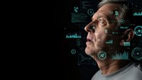 Middle-aged Caucasian man analyzing futuristic holographic data interface with charts and graphs in dark tech environment for business analytics.