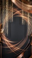Golden light trails swirl through sparkling curtain backdrop creating dynamic motion blur effect for luxury event photography and celebration designs.