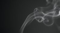 Delicate white smoke swirls gracefully against a dark background, creating an abstract, ethereal atmosphere with soft flowing curves.