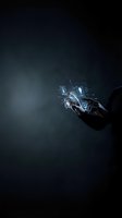 Businessman hand holding glowing holographic car interface with digital technology visualization against dark background for automotive innovation and future transportation concepts.