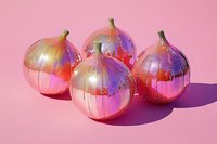 Shiny metallic onions with holographic rainbow finish on pink background, isolated for design use on packaging, posters, and digital projects.