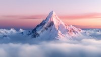 Majestic snow-capped mountain peak rising above clouds at sunrise with pink and purple sky. Alpine landscape for travel, adventure and nature concepts.