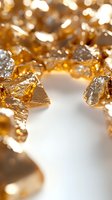 Shimmering golden nuggets and fragments with metallic luster on white background, creating luxurious bokeh effect. Macro photography highlights rich texture and shine.