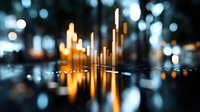 Golden financial bar chart rising from reflective surface with bokeh city lights background representing business growth and market success.