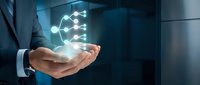 Businessman holding glowing network connection hologram in palm, showcasing digital connectivity and modern technology solutions for corporate innovation.