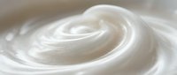 Smooth white cream swirl with soft texture and elegant curves for skincare, cosmetic and beauty product applications.