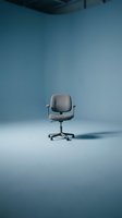 Gray office chair with armrests and wheels on blue background. Minimalist workspace furniture for corporate, business, and interior design projects.
