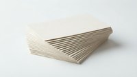 Stack of blank white business cards fanned out on isolated background, ready for branding and corporate design projects.