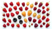 Fresh mixed berries collection with strawberries, raspberries, blackberries and golden berries arranged on white background for healthy eating concepts.