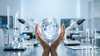 Scientist hands holding glowing globe with digital network pattern in modern laboratory with microscopes and glass equipment, representing global research and innovation.
