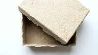 Handmade recycled cardboard box with lid open on white background, eco-friendly packaging material for sustainable shipping and storage solutions.
