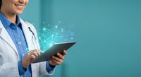 Female doctor using digital tablet with medical network connections and data visualization for modern healthcare technology and telemedicine applications.