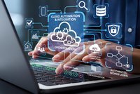 Business professional using laptop with cloud automation and integration technology overlay icons for digital transformation and workflow optimization.