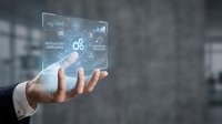 Businessman hand holding futuristic holographic interface with data analytics charts and digital technology elements for modern business solutions.