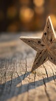 Rustic wooden star decoration on weathered wood surface with warm bokeh background for holiday crafts and seasonal home decor projects.