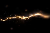 Glowing golden light streak with sparkling particles on dark background, abstract energy wave effect for magical and technological designs.