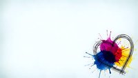 Colorful paint splashes forming heart shape with brush strokes on white background for creative design projects and artistic concepts.