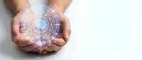 Hands holding glowing digital sphere with circular data patterns and blue light effects for technology and innovation concepts.