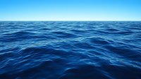 Tranquil deep blue ocean waves stretching to horizon under clear sky, natural seascape background showing endless water surface with gentle ripples.