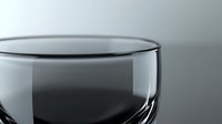 Empty transparent glass with curved rim and reflective surface against neutral gray background, minimalist composition highlighting purity and elegance.