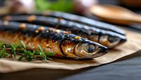 Grilled mackerel fish with fresh herbs on brown paper, close up view showing crispy skin and juicy meat, selective focus on fish head with dark wooden background.