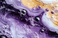 Abstract fluid art with purple and gold swirls, bubbles and organic textures creating dynamic liquid paint patterns for modern design projects.