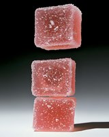 Stacked pink gummy candies coated with sugar crystals, isolated on white background, ready for confectionery, food packaging, and candy shop design projects.