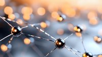 Glowing metallic spheres connected by silver lines create futuristic network pattern against blurred bokeh background, suggesting technology and connectivity.