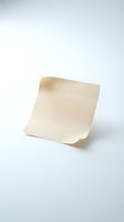 Blank cream colored paper sheet curled and isolated on white background, ready for design mockups, branding, stationery templates, and packaging presentations.