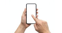 Hands holding smartphone with blank white screen, finger touching display for mobile app mockup and digital interface design on isolated background.